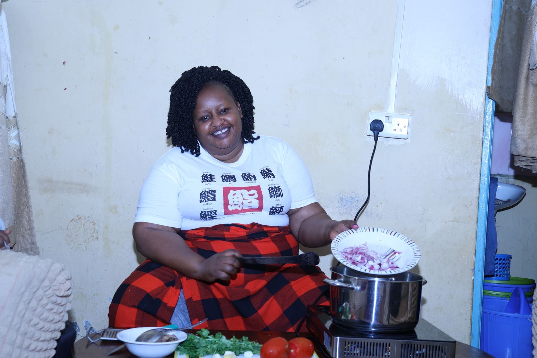 Caroline Wairimo using induction cooker