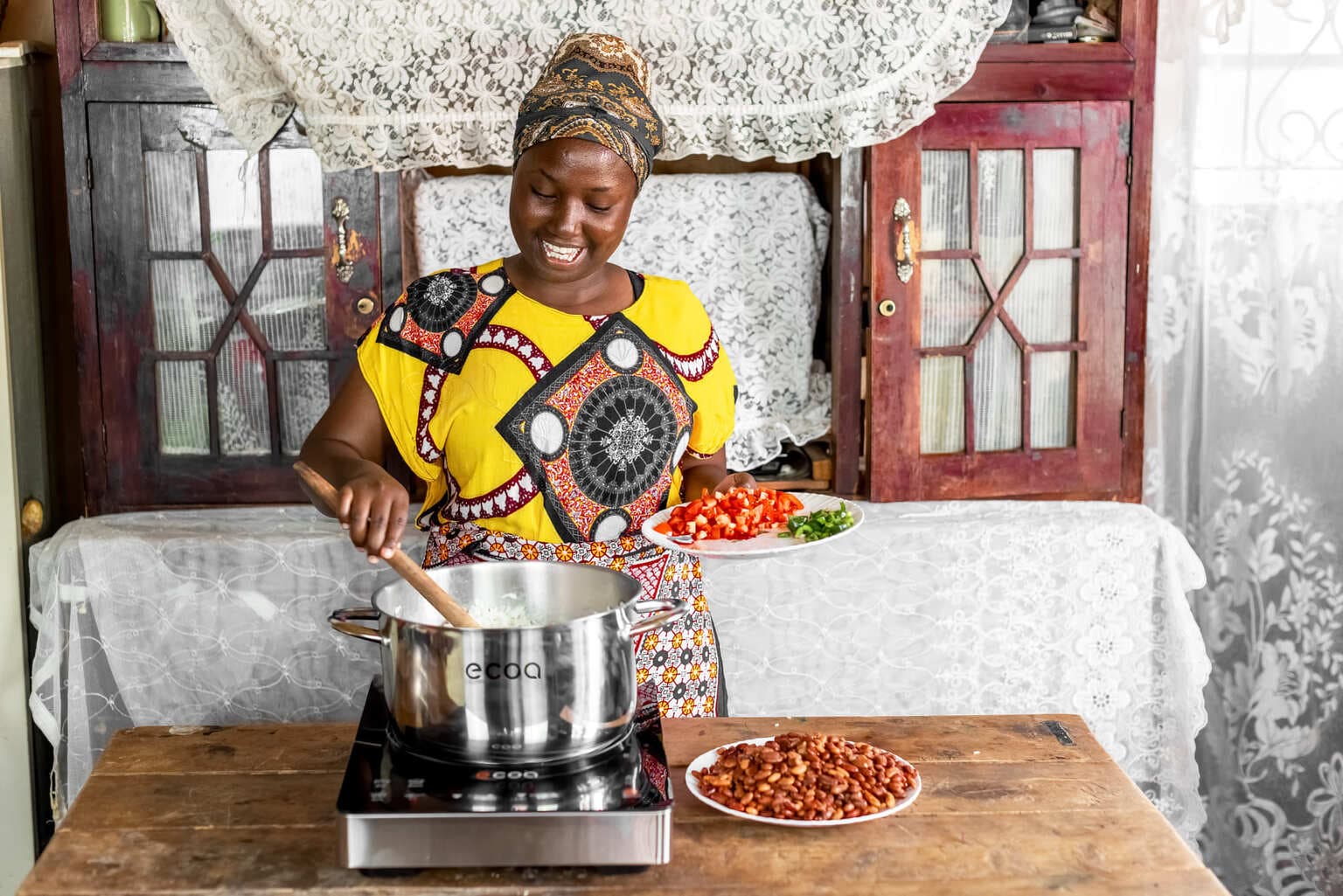 Margret Waithera using induction cooker