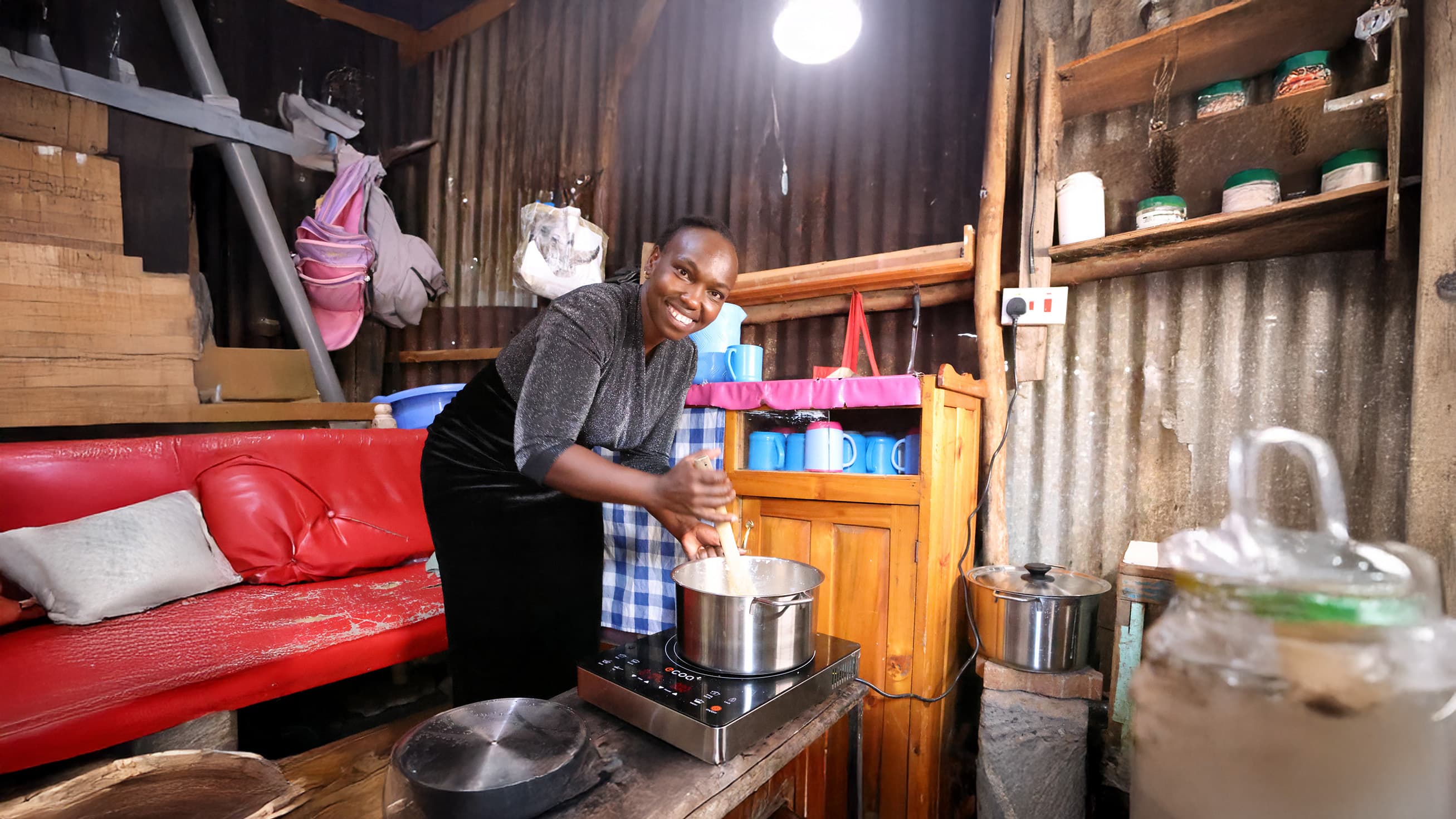 Woman cooking on a clean stove in Africa