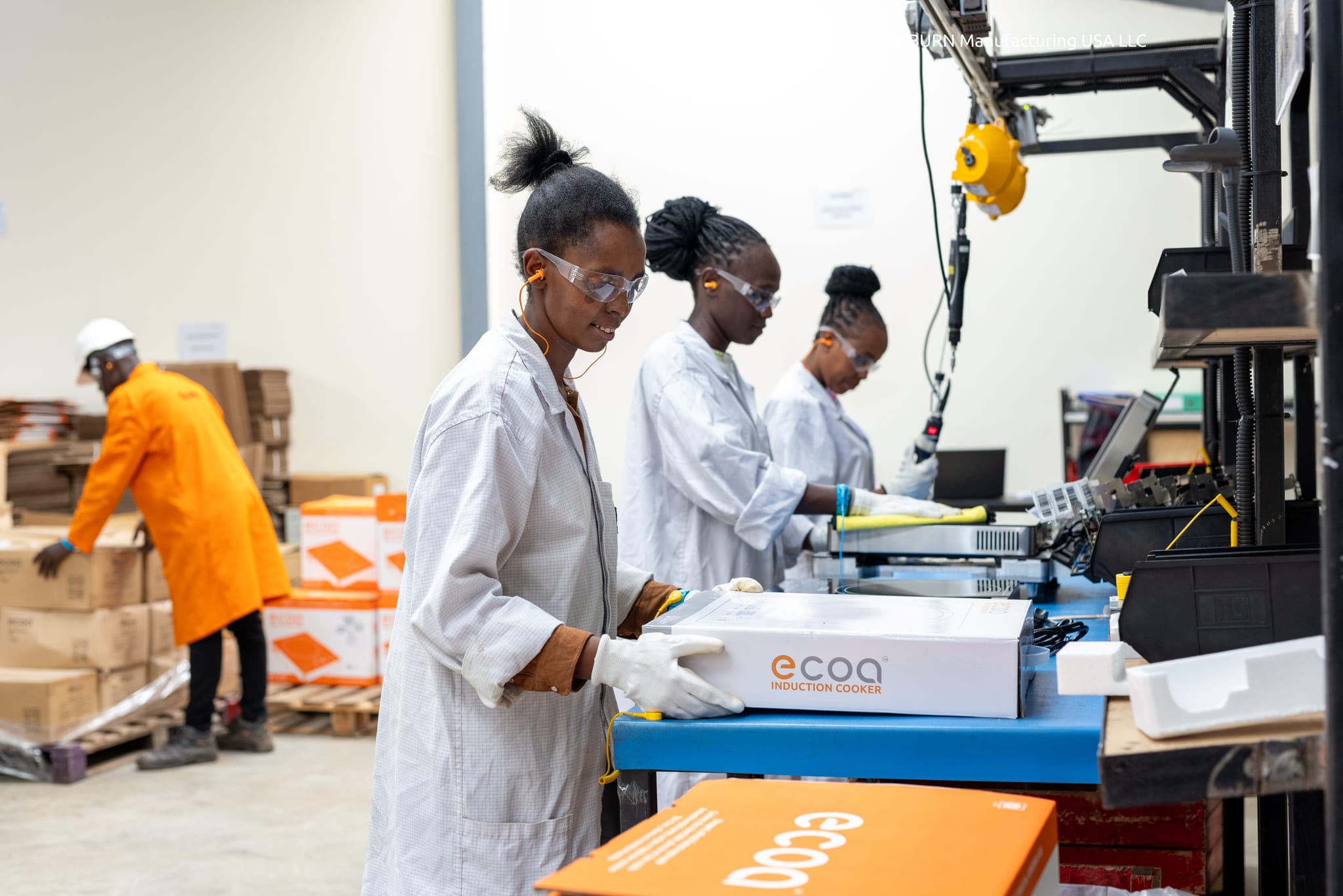 James Wasonga, Lucy Kagure, Catherine Njeri and Charity Wairimu working at the Ecoa Induction Cooker Line at BURN Manufacturing