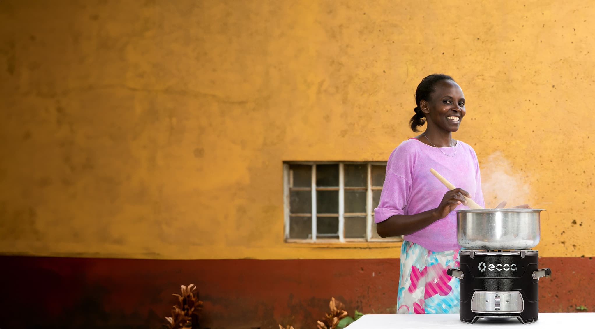 BURN community member using a clean cookstove